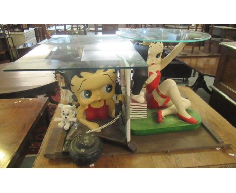 Collection of Betty Boop items to include two glass top lamp tables, Betty Boop figurine, and framed Betty Boop montage pictu