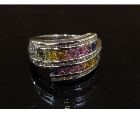 A 9ct white gold multi-coloured sapphire and diamond ring. Size R, 6.5g