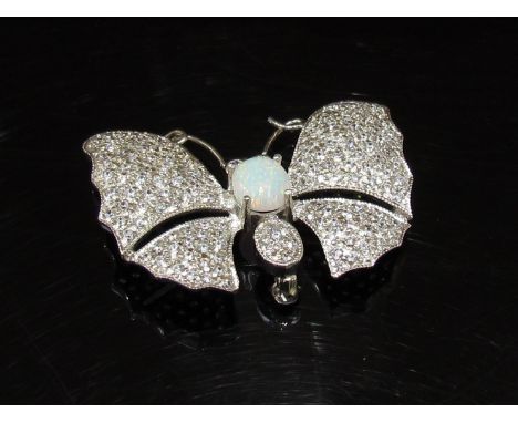 An opal and crystal butterfly brooch stamped 925, 4.7cm wide, 12.4g