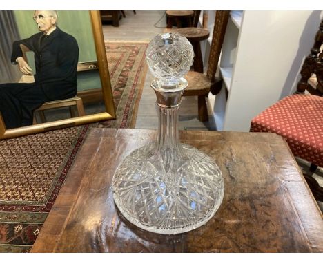 A crystal glass ships decanter with silver collar by Barker Ellis Silver Co, Sheffield 1979