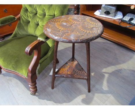 A circa 1900 Japanese two tier circular top lamp table with carved chrysanthemum and stem decorated tri-leg supports, 44cm di