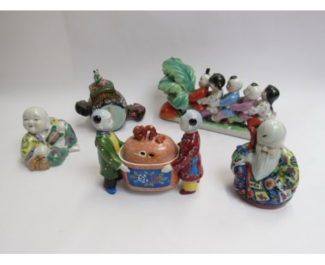 Five 20th Century ceramic Oriental figures including drum form container and Chinese made 