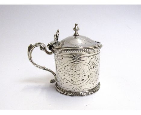 A Victorian silver mustard W E London 1856 with urn finial, engine-turned body and cover, beaded gadrooned rim, scrolled hand