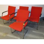 Four red upholstered audience chairs from the Press Conference Room at Liverpool Football Club's