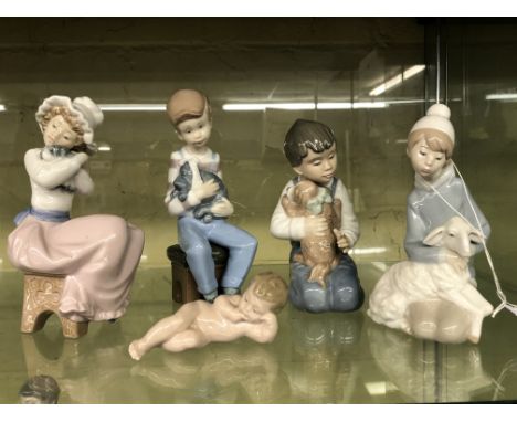 THREE NAO FIGURE GROUPS - SEATED CHILDREN WITH PUPPIES, LLADRO FIGURE 4676 AND A NAO RECUMBENT BABY FIGURE
