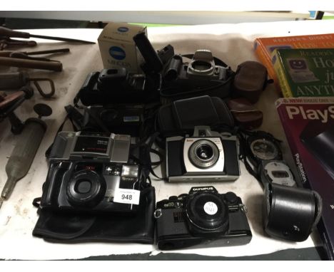 A QUANTITY OF CAMERAS TO INCLUDE AN OLYMPUS OM 10, KODAK BROWNIE 44A, NIKON F80, FUJI DL-800 ZOOM, CANON SURE SHOT MAX, MINOL