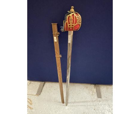 A VINTAGE OFFICERS STYLE SWORD AND SCABBARD WITH GILT DESIGN HANDLE 