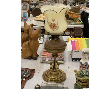 AN ARTS AND CRAFTS STYLE OIL LAMP WITH GLASS FLORAL SHADE 
