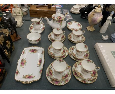 A ROYAL ALBERT 'OLD COUNTRY ROSES' TEASET TO INCLUDE A TEAPOT, CREAM JUG, SUGAR BOWL,SANDWICH AND CAKE TRAYS, CUPS, SAUCERS A