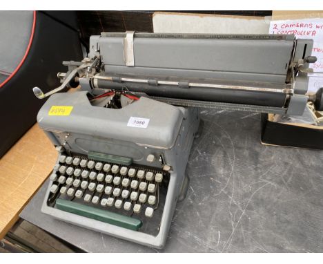 A VIUNTAGE IMPERIAL TYPEWRITER 