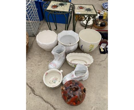AN ASSORTMENT OF CERAMIC PLANT POTS AND TWO METAL AND TILE TOP PLANT STANDS 