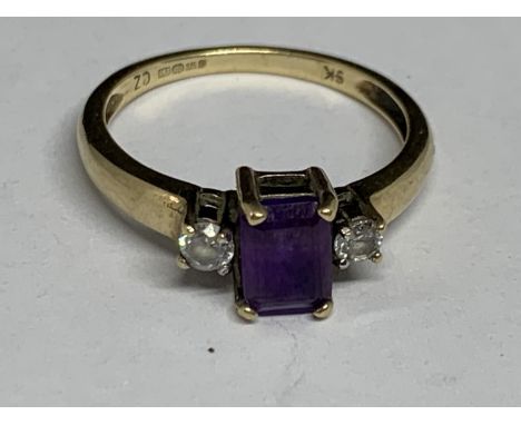 A 9 CARAT GOLD RING WITH A SQUARE AMETHYST WITH A CUBIC ZIRCONIA EACH SIDE SIZE P 