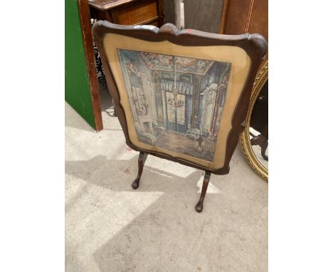 A MAHOGANY 'DAVRARD PATENT' EARLY 20TH CENTURY FOLD-OVER FIRESCREEN/TABLE WITH INSET WOOLWORK OF HOUSE INTERIOR 
