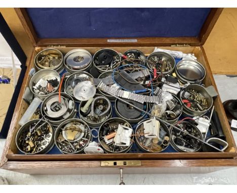 A VINTAGE OAK CANTEEN CONTAINING ASSORTED WATCH AND CLOCK SPARE PARTS AND ACCESSORIES 