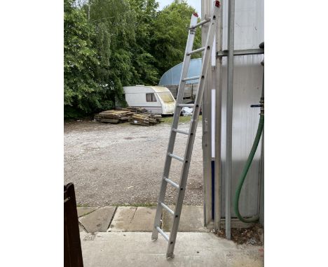 A NINE RUNG ALUMINIUM LADDER 