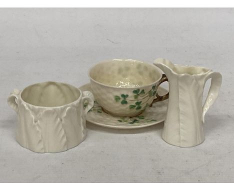 A BELLEEK SHAMROCK TEACUP AND SAUCER TOGETHER WITH A ROYAL WORCESTER SMALL LEAF JUG AND SUGAR BOWL 