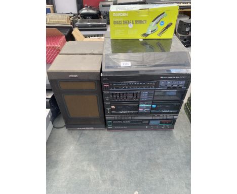 A PHILIPS STEREO SYSTEM WITH CASSETTE DECK, CD PLAYER, RECORD PLAYER AND TWO SPEAKERS ETC 