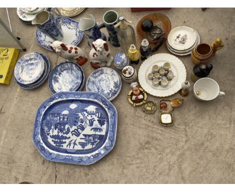AN ASSORTMENT OF ITEMS TO INCLUDE BLUE AND WHITE PLATES, CERAMIC MUGS AND STAFFORDSHIRE SPANIELS ETC 