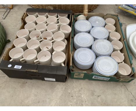 A LARGE ASSORTMENT CERAMIC CUPS AND SAUCERS 