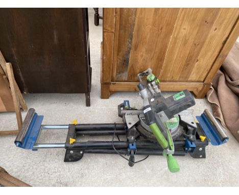 AN EVOLUTION ELECTIC MITRE SAW AND A WORKZONE WOOD ROLLER STAND 