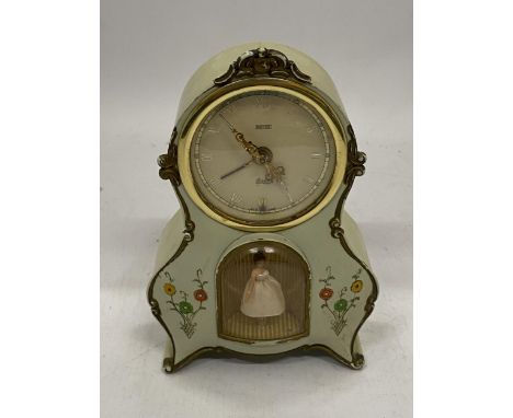 A VINTAGE MANTLE CLOCK WITH AN INSET DANCING BALLERINA 