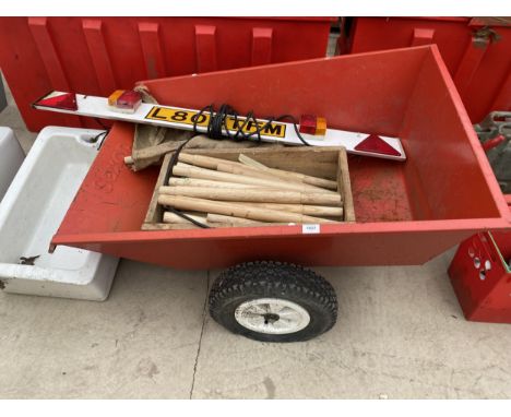 A TWO WHEELED GARDEN TRAILER, A LIGHT BOARD AND SHOVEL HANDLES 