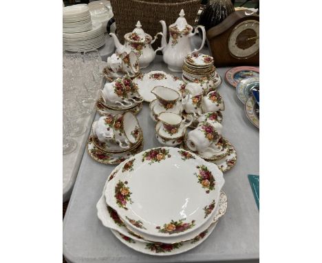 A LARGE QUANTITY OF ROYAL ALBERT 'OLD COUNTRY ROSES' TO INCLUDE A TEA AND COFFEE POT, CAKE PLATES, CREAM JUGS, SUGAR BOWLS, C