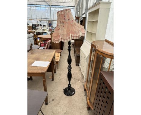 A MODERN BLACK PAINTED STANDARD LAMP COMPLETE WITH SHADE 