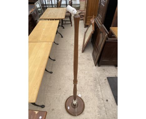 A STANDARD LAMP ON TURNED AND FLUTED COLUMN 