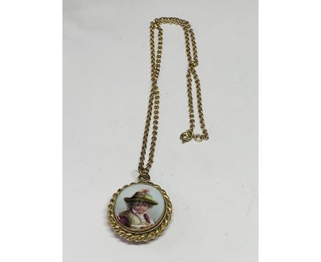 A VICTORIAN LOCKET WITH A CERAMIC FRONT WITH A PICTURE OF A YOUNG BOY 