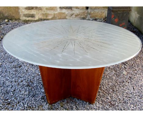 Unusual 1960s teak and glass lighted coffee table, the opaque circular top with clear sunburst decoration upon a triform teak