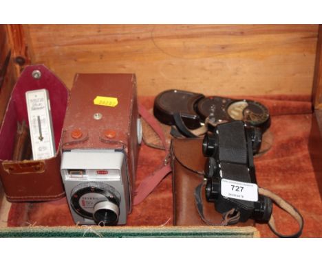 A pair of leather cased Carl Zeiss binoculars; a Bakelite tempiphot light meter; a Brownie camera; further photo telemeter et