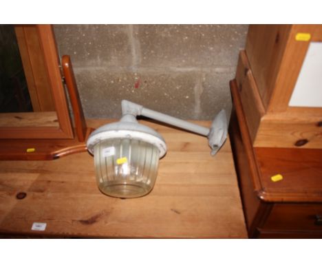 A metal and glass outdoor light