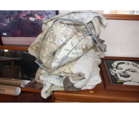 A double quilt; eiderdown; and two shawls 