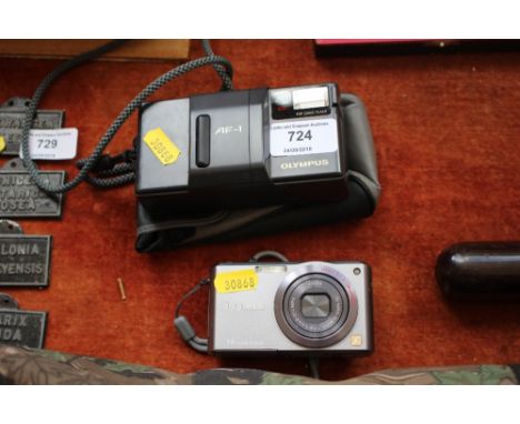 A Pansonic Lumix digital camera; and an Olympus automatic film camera 