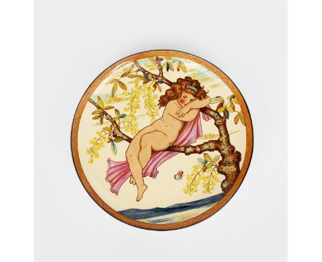 A Mintons Art Pottery Studio wall charger in the manner of W S Coleman,  painted with a young girl resting amidst lilac bough