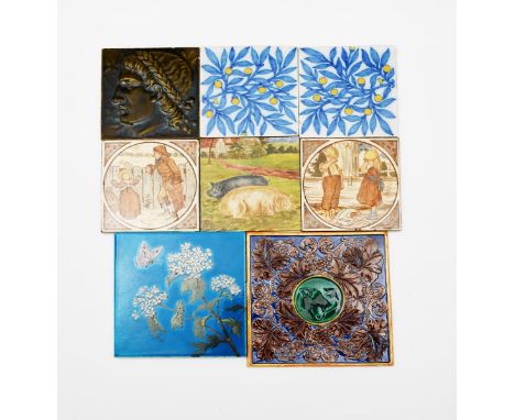A large Aesthetic Movement  Minton's tile, painted with a butterfly flying past a flower stem, in colours on a vivid blue gro