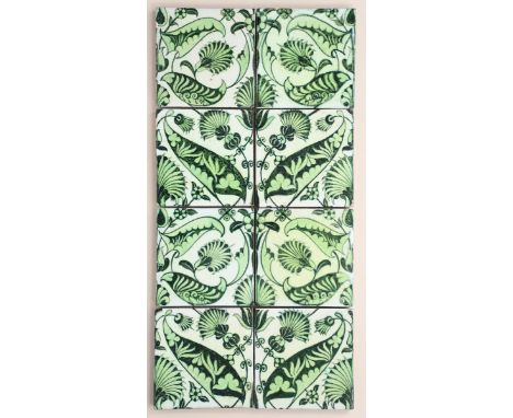 A William De Morgan eight tile panel,  painted with scrolling foliage in green on a white ground, mounted on frame, impressed
