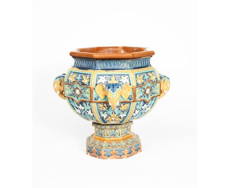 A Doulton Lambeth low stoneware Indian Vase jardiniere and stand, octagonal form cast in low relief with panels of flowers an