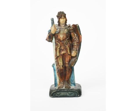 St George a Compton Pottery The Potters' Arts Guild figure designed by Mary Seton Watts, modelled standing holding a tall swo