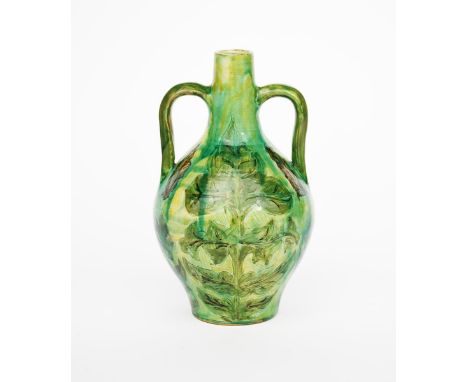 A Della Robbia pottery Moorish vase by Liz Wilkins,  twin-handled form incised and painted with large leaves in green, brown 