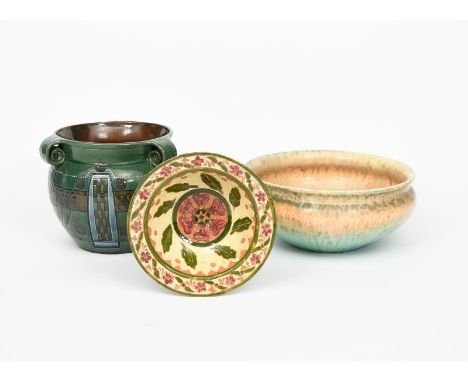 A Della Robbia Pottery bowl by Agnes, painted with bands of radiating foliage from a central Tudor rose, the rim with smaller