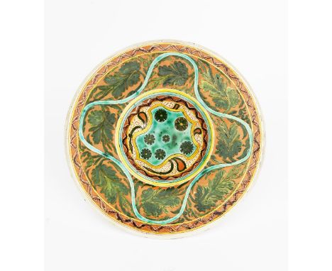 A Della Robbia Pottery charger by Violet Woodhouse, dated 1895,  incised and painted with flower mon inside geometric bands t