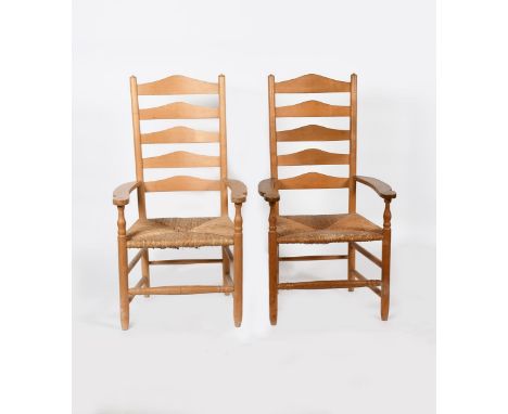 A pair of natural ash LCC armchairs by Neville Neal, with rush seat, one waxed, stamped marks, 119cm. high, (2) Provenance Ri