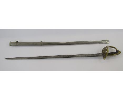 Victorian officer's dress sword with brass guard, fish skin grip, engraved blade and plated scabbard