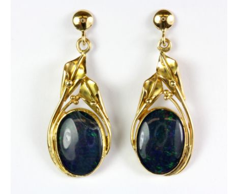 A pair of yellow metal (tested 18ct gold) black opal set drop earrings, L. 4.5cm.