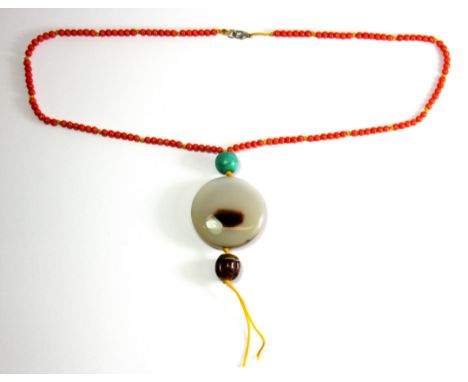 A Tibetan agate and coral necklace, L. 35cm.