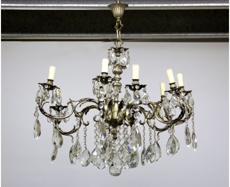 A large contemporary eight branch crystal chandelier light fitting with 9.5cm drops, H. overall 80cm, Dia. 80cm.