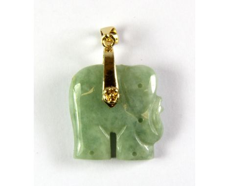 A yellow metal mounted carved jade elephant pendant, L. 4cm.