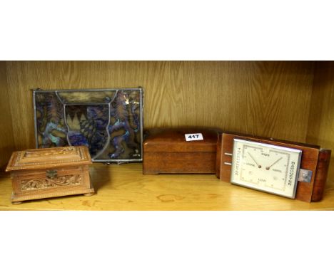 Two wooden boxes, a stained glass panel and a barometer.